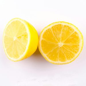 Close-up of fresh, juicy lemon halves on a clean white background.
